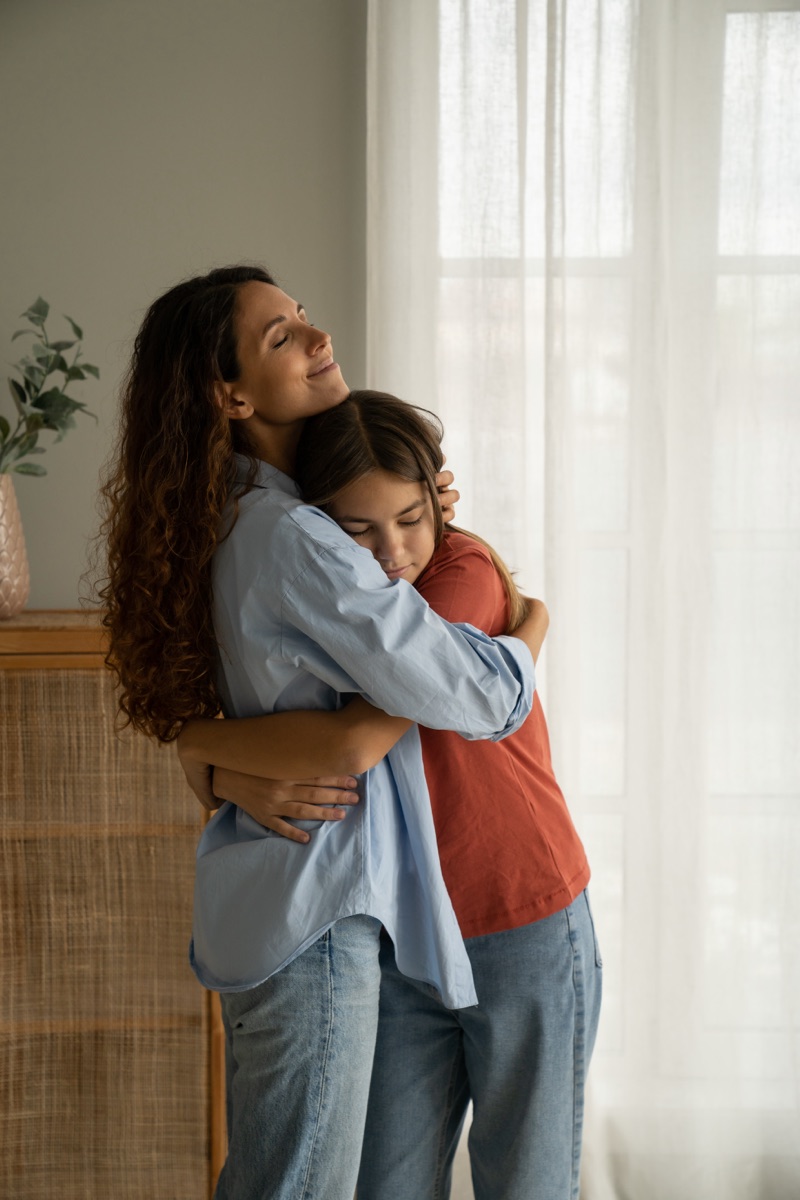 A parent and child embracing